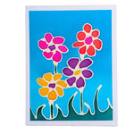 Load image into Gallery viewer, A HAND PAINTED PURE SILK ORIGINAL  art  card GREETING CARD featuring a colorful abstract floral design with four stylized flowers in pink, red, yellow, and purple on a bright blue background, bordered by a white margin.

