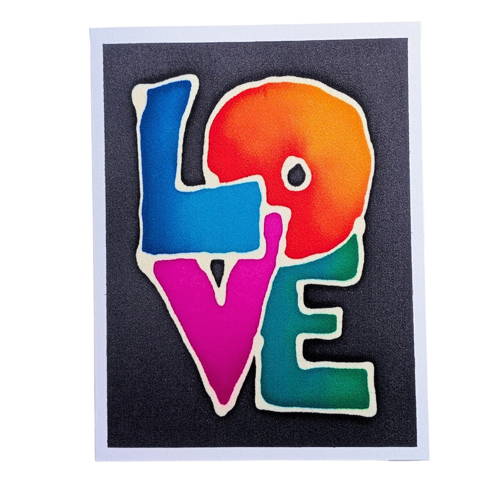 A hand painted pure silk original art greeting card featuring the word 'LOVE' in large, colorful gradient letters outlined in white, set against a dark charcoal background with a white border.