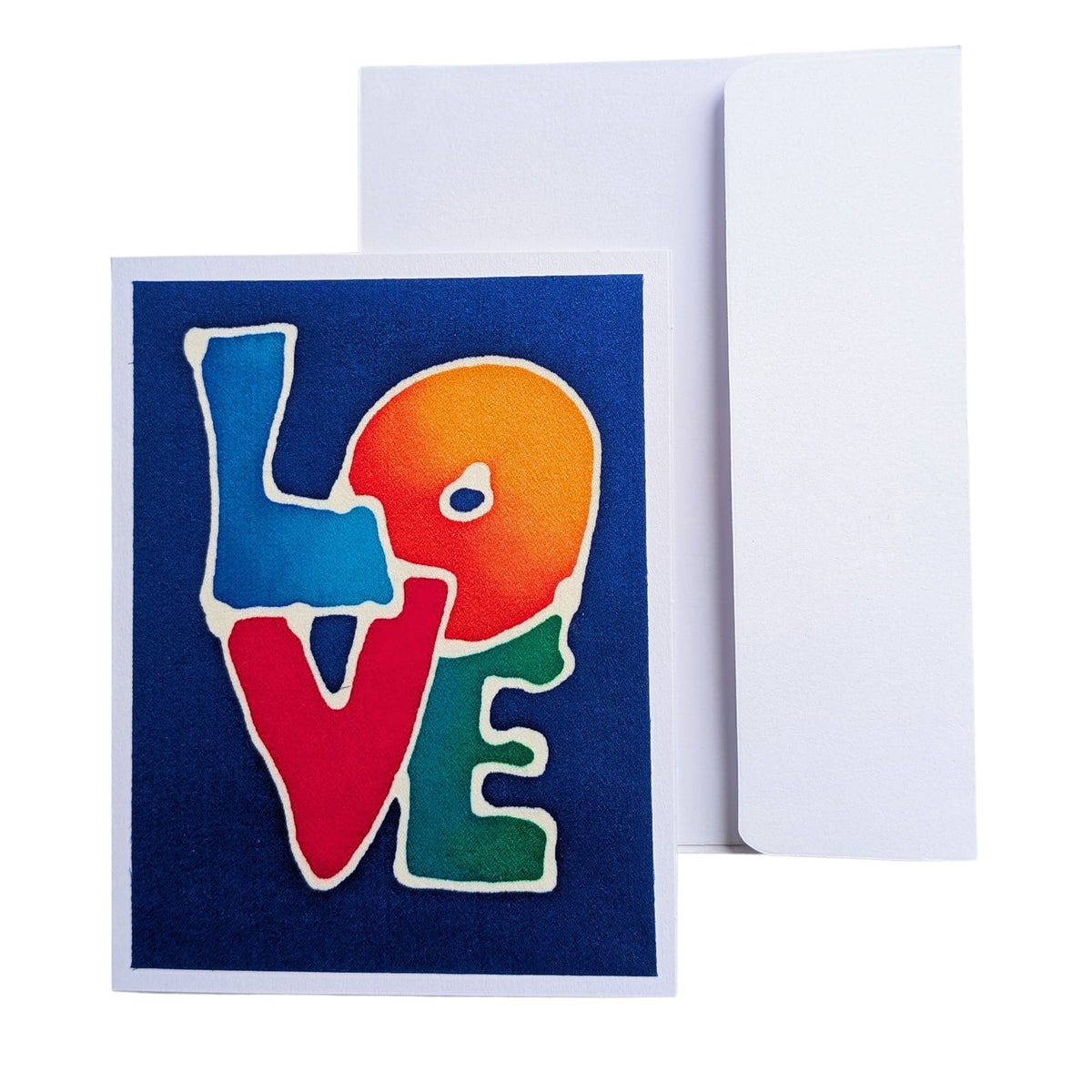 A hand painted pure silk original art card  greeting card with a textured dark blue background and the word 'LOVE' spelled out in large, colorful letters outlined in white, shown with a plain white envelope behind it on a white background.