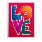 Ahand painted pure silk original art greeting card featuring the word 'LOVE' in large, colorful gradient letters outlined in white on a bright red background, with a thin white border around the print.