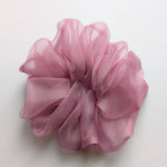 Load image into Gallery viewer, A large, ruffled PURE SILK organza hair scrunchie in dusty pink, photographed from directly above on a clean white background.
