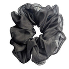 A pure silk oversized jumbo  black sheer hair scrunchie with a ruffled texture, 