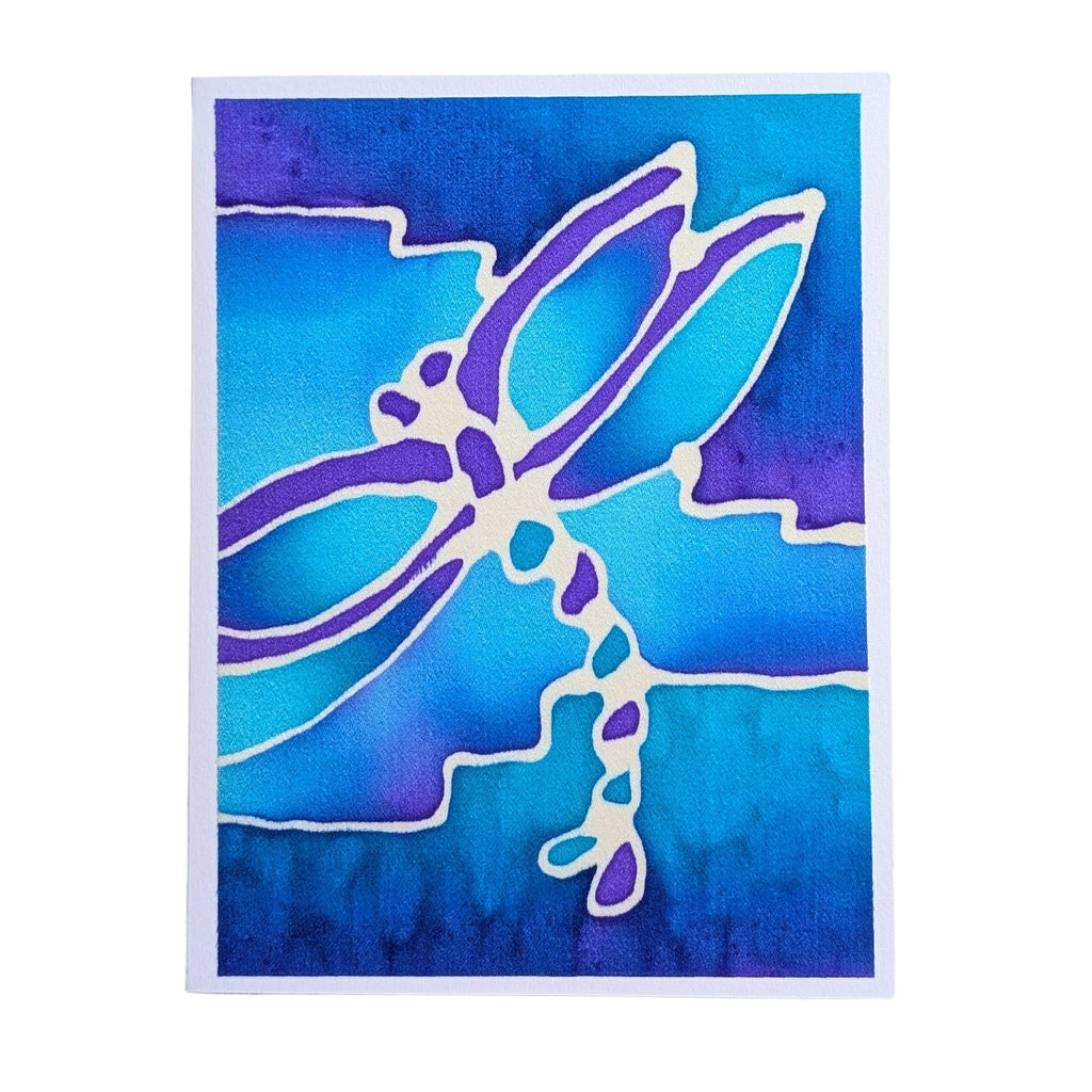 A hand painted pure silk art original  greeting card featuring a stylized dragonfly design in purple and white against a watercolor-style blue and purple background.