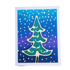 A painted silk original art greeting card featuring a stylized Christmas tree illustration. The tree is teal-green with white snow-like accents, set against a blue and purple gradient background filled with white dots.