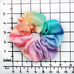 Load image into Gallery viewer, Medium size scrunchie hair accessory ponytail holder hand dyed rainbow color handmade in Canada by Lynne Kiel
