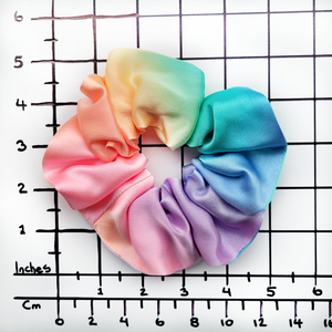 Medium size scrunchie hair accessory ponytail holder hand dyed rainbow color handmade in Canada by Lynne Kiel