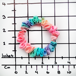 Load image into Gallery viewer, rainbow color pure sil skinny scrunchie hair accessory ponytail holder handmade by Lynne Kiel
