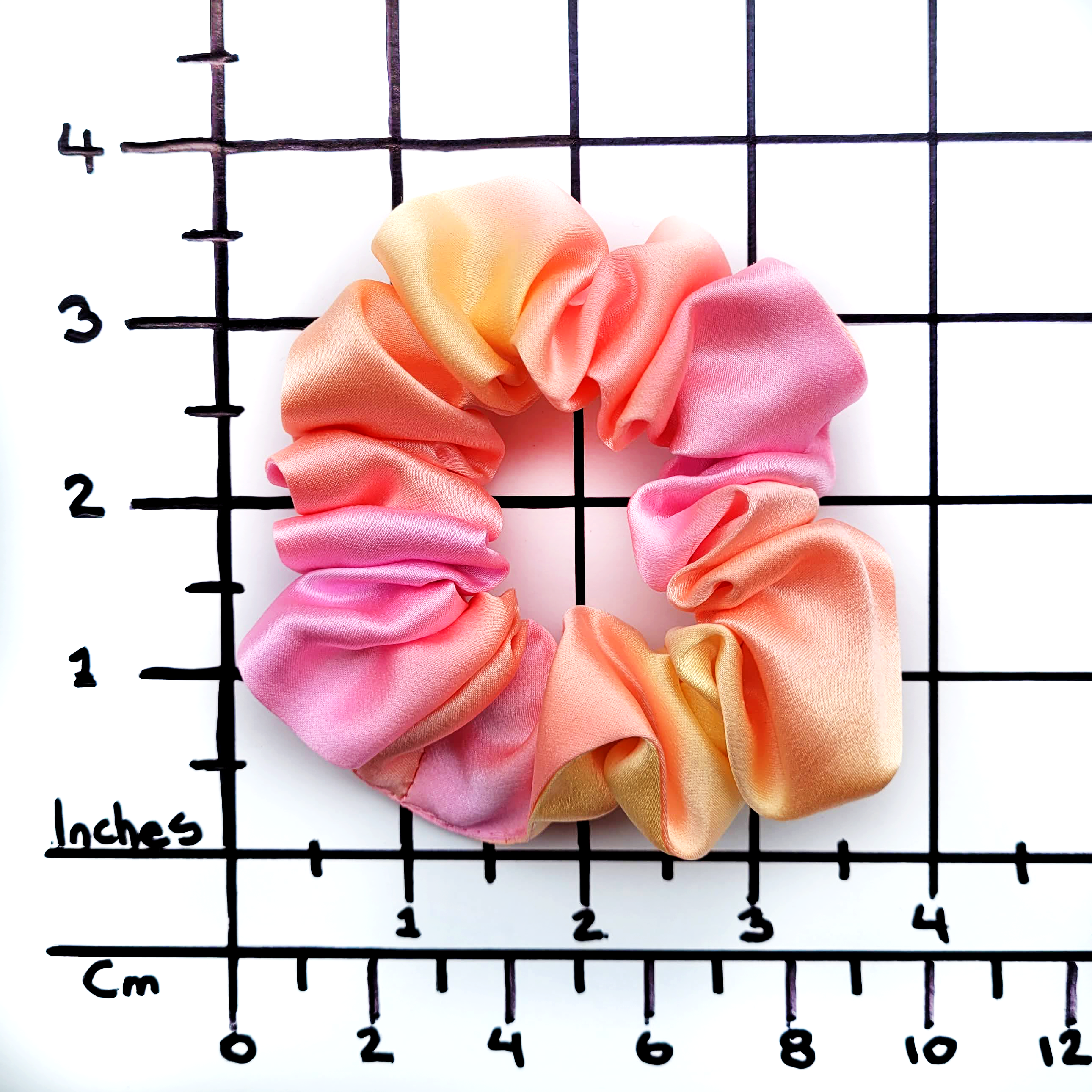 small size pure silk scrunchie hair accessory ponytail holder hand dyed orange pink color handmade by Lynne Kiel
