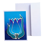 Load image into Gallery viewer, A2 SIZE HAND PAINTED PURE SILK ORIGINAL ART CARD greeting card with a stylized tulip design in blue, teal, and purple, shown in front of a plain white envelope on a white background.
