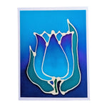 Load image into Gallery viewer, A HAND PAINTE PURE SILK ORIGINAL ART card GREETING CARD featuring a stylized tulip design with layered petals in shades of blue, teal, and purple, outlined in white against a blue gradient background.
