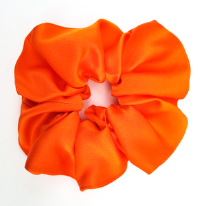hair accessory orange silk satin scrunchie for gymnastics and sleeping handmade in Canada by Lynne Kiel 