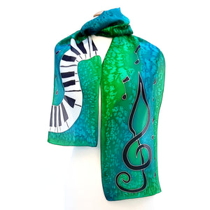 green silk scarf hand painted piano treble clef art made by Lynne Kiel