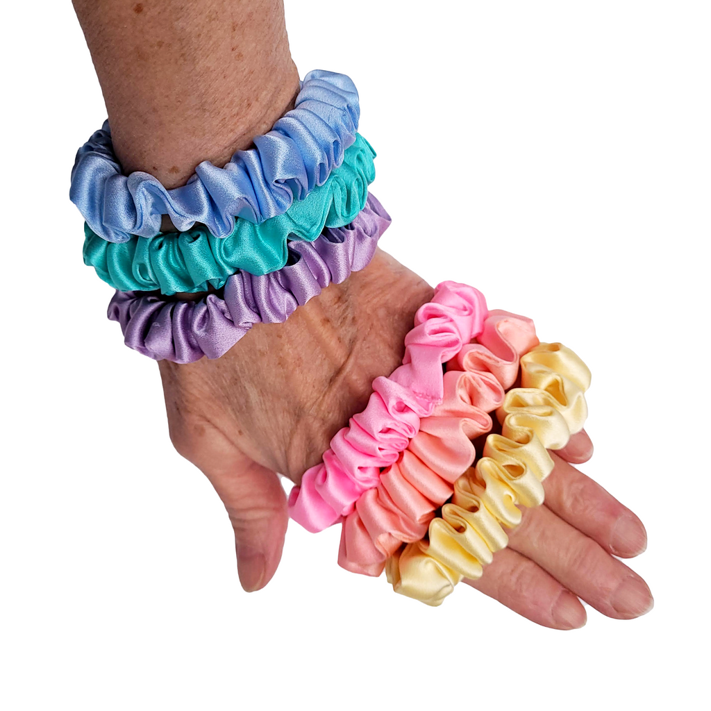 Silk skinny scrunchies pure silk pastel pink green purple orange blue colors made in Canada by Lynne Kiel
