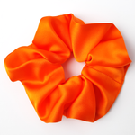 Load image into Gallery viewer, jumbo orange silk scrunchie for yoga and gymnastics
